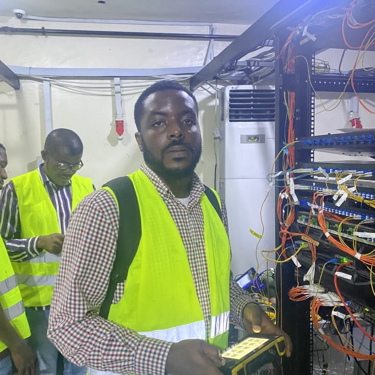 A group of people maintaining a server room